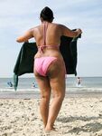 Big ass mature wife goes topless in the beach