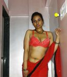 Sexy Auntie in red saree will make you horny