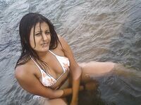 Nude bathing girl looks wet & wild