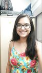 Smiling Indian girl in glasses goes nude for lover