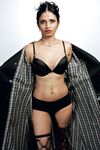 Beautiful Indian female sheds an overcoat to model in underwear and stockings