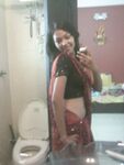 Indian babe taking shower posing
