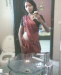 Indian babe taking shower posing