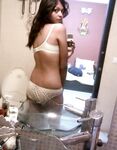 Indian babe taking shower posing