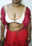 Mature indian housewife taking her indian outfits off in bedroom