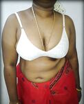 Mature indian housewife taking her indian outfits off in bedroom