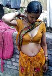 South Indian bhabhi posing in sari showing tits ass pics