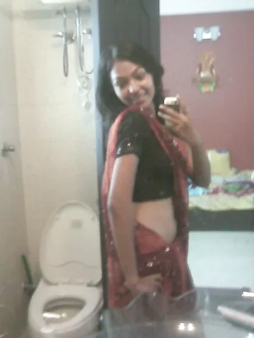 Indian babe taking shower posing