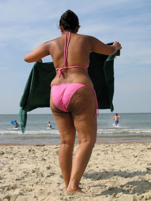 Big ass mature wife goes topless in the beach