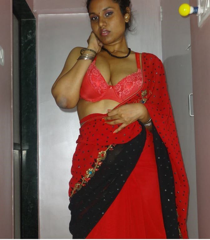 Sexy Auntie in red saree will make you horny