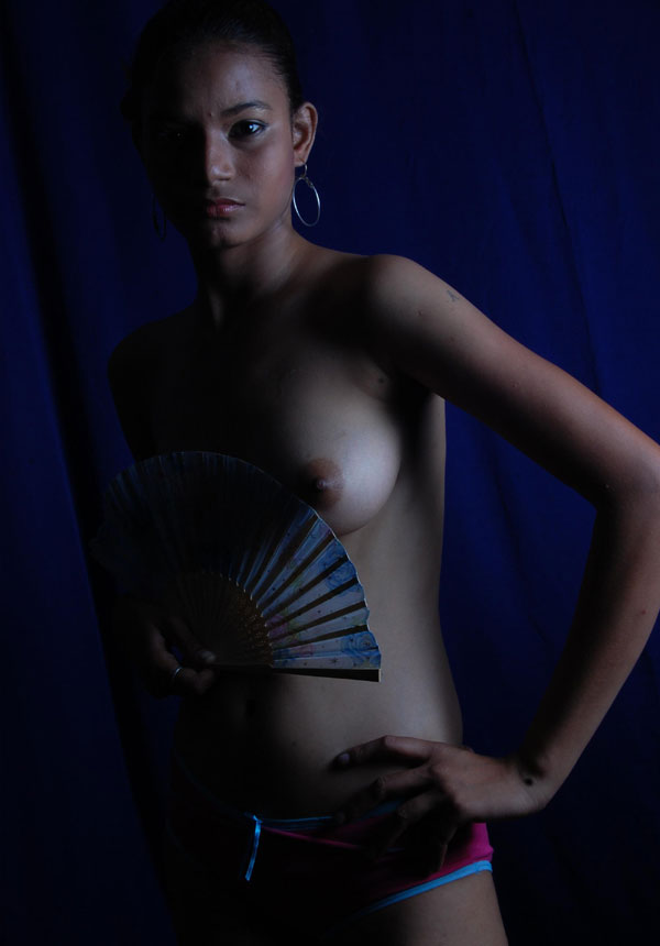 Cute Indian girl nude photos shot inside studio exposed