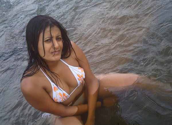 Nude bathing girl looks wet & wild