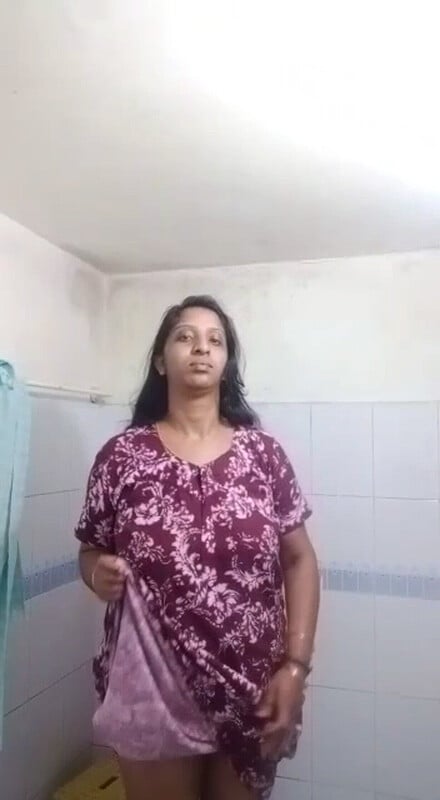 Unsatisfied Indian aunty stripping nude pics in bathroom