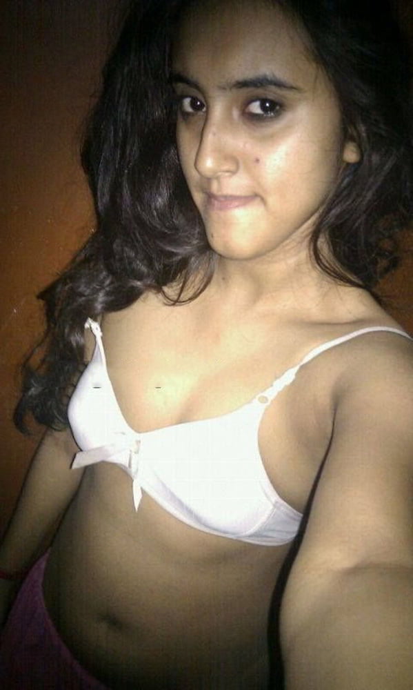 Indian skinny slut showing her small tits photos