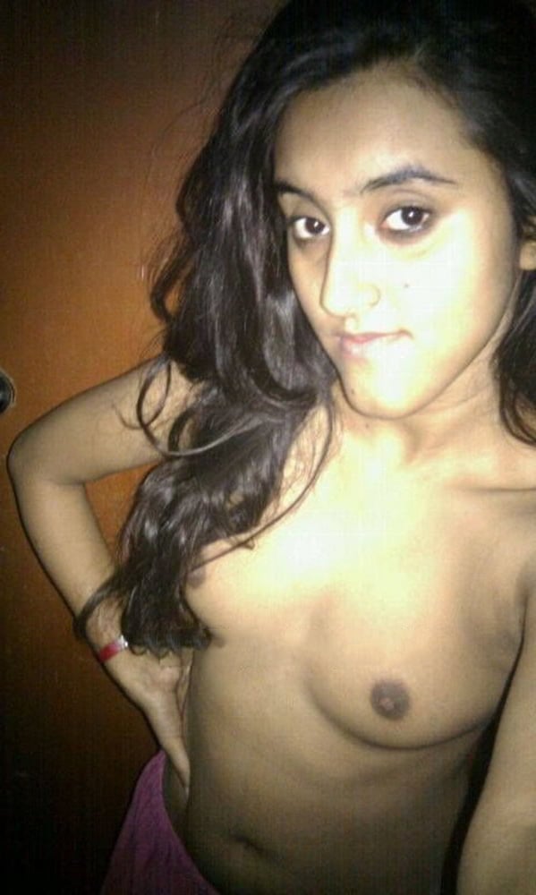 Indian skinny slut showing her small tits photos