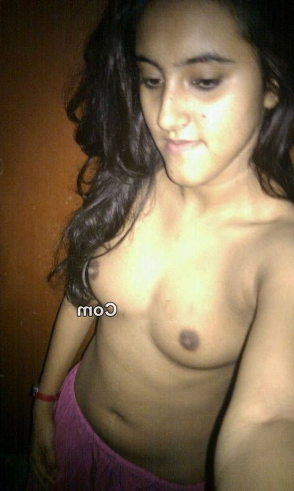 Indian skinny slut showing her small tits photos