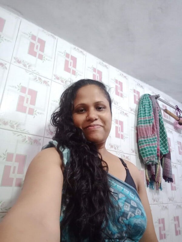 MILF standing topless in bathroom selfie show