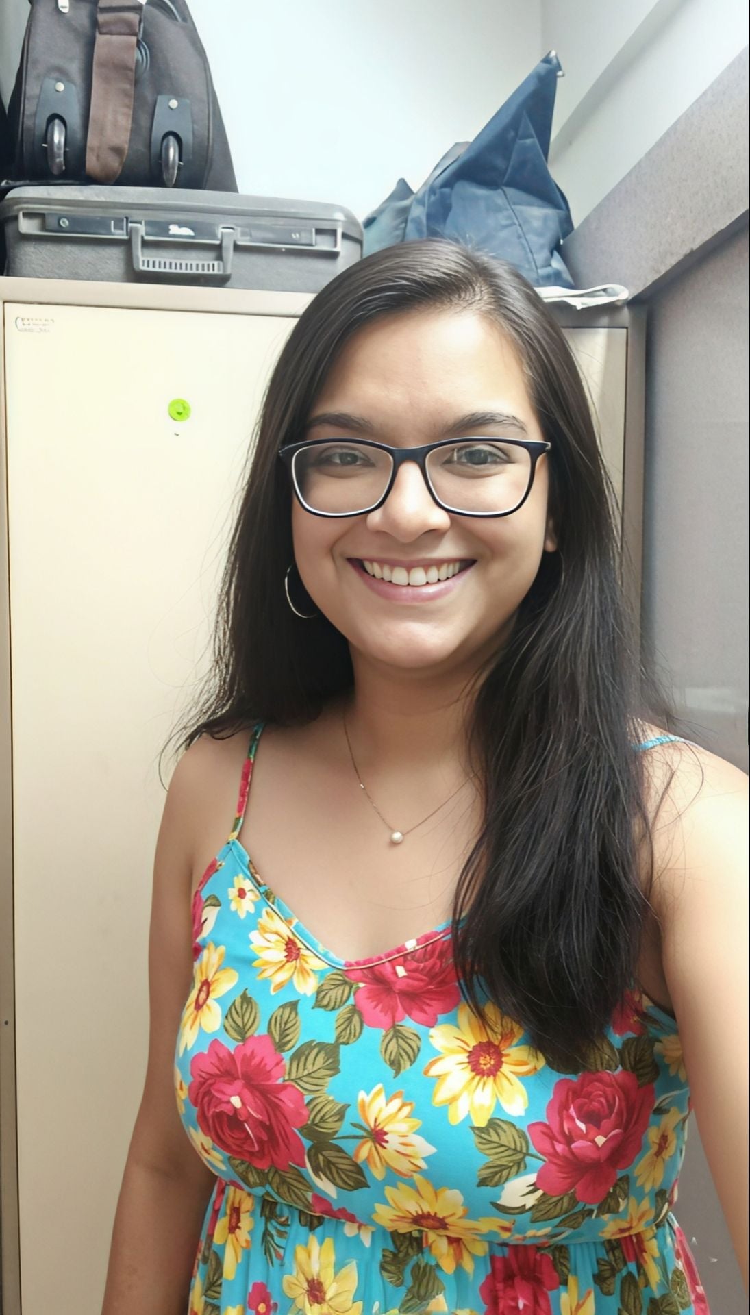 Smiling Indian girl in glasses goes nude for lover