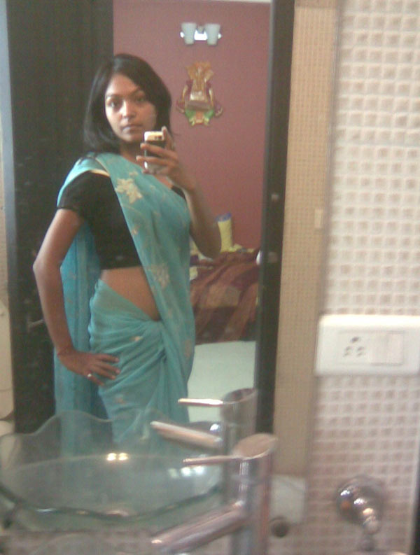 Indian babe taking shower posing