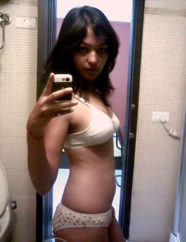 Indian babe taking shower posing