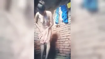 Attractive Desi village girl displays XXX assets while bathing nude
