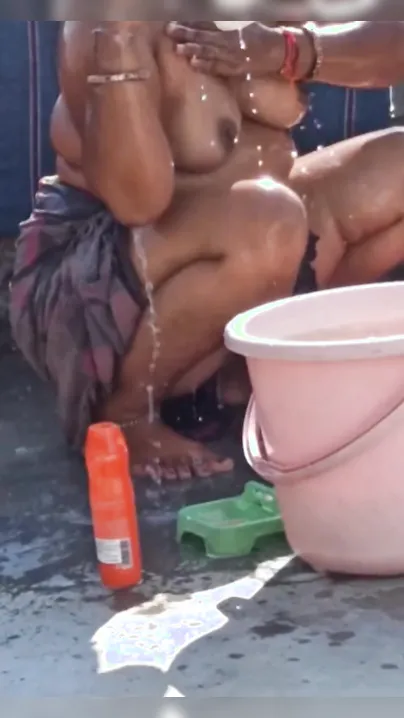 Chubby Desi bhabhi poses for XXX video when bathing topless outdoors