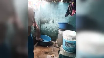 Voyeur XXX cam catches mature Desi female bathing topless outdoors