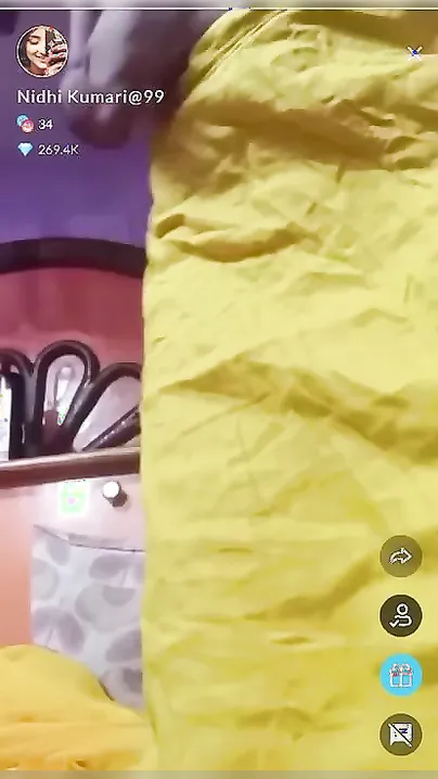 Desi wife takes yellow sari off and flaunts titties on XXX camera