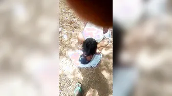 Guy lies on top of Desi girlfriend in front of XXX cameraman outdoors