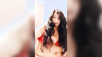 Sultry Desi bhabhi in red lingerie plays with her XXX breasts on cam