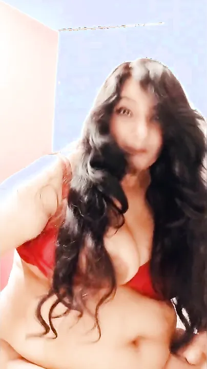 Sultry Desi bhabhi in red lingerie plays with her XXX breasts on cam