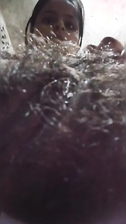 Shameless Desi wench shows off and spreads her hairy XXX twat on cam