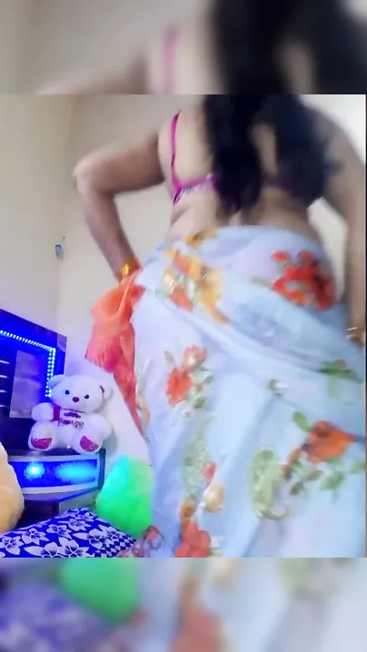 Desi takes sari down a bit to expose her naked XXX assets at home