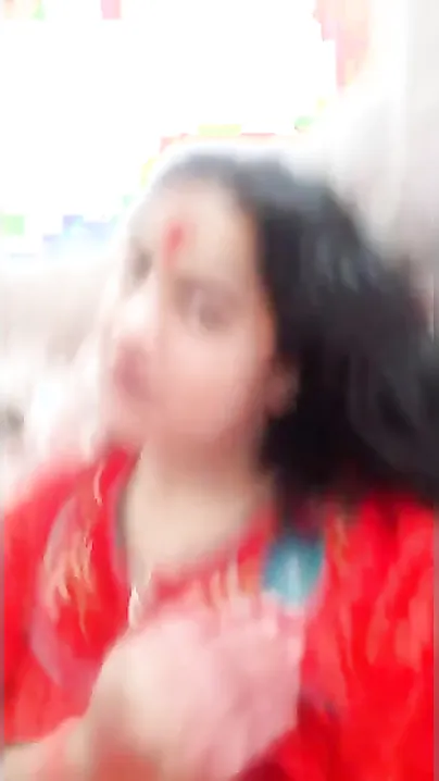 Plump amateur Desi wife in a red sari performs hot XXX striptease