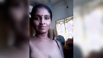 Desi with saggy boobs takes XXX pose on cam and masturbates with toy