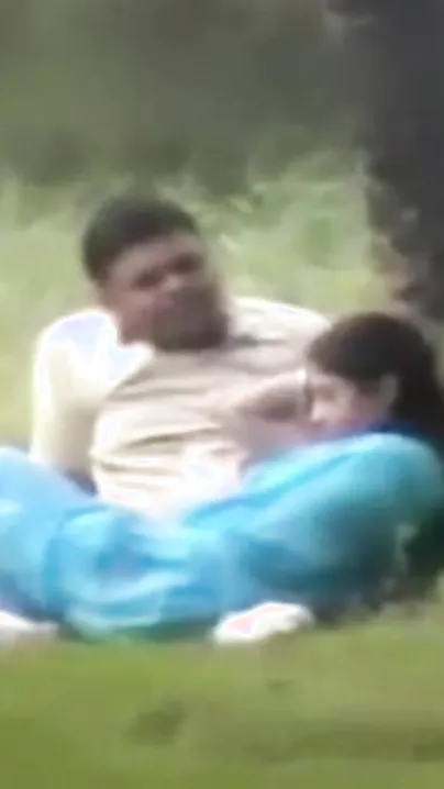 Beautiful Indian wife in blue saree with her lover in public park