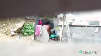 Neighbor on a hidden camera caught aunt taking a bath on the outdoor naked