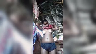 Village Girl Getting Dressed After Bathing By The Well