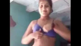 Young Babe Revealing Her Tits And Pussy For The Camera