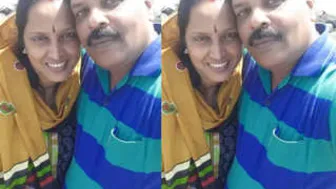 Indian Couple Kissing And Touching Outdoors In Public Park