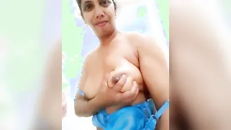 Busty Desi Aunty Revealing Her Massive Natural Tits At Home