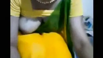 Wife In Yellow Saree Showing Her Boobs Teasing On Webcam For Tips