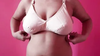 Busty Babe Putting On Her Bra Showing Big Bouncing Boobs Jiggling