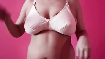 Busty Babe Putting On Her Bra Showing Big Bouncing Boobs Jiggling