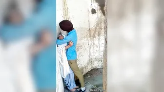 College Lovers Making Out And Kissing In Outdoor Public Spot