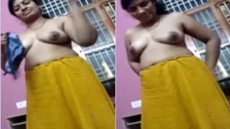 Sexy Bhabhi Putting On Her Bra Teasing In Front Of The Camera