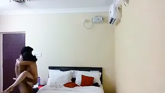 Young Couple Checking Into Cheap Hotel Room For Afternoon Session