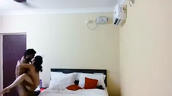 Young Couple Checking Into Cheap Hotel Room For Afternoon Session