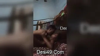 Village Couple Getting Intimate Under Blanket In Small Room