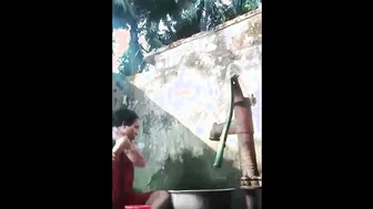 Village Aunty Bathing Outdoors Showing Off Her Natural Saggy Tits